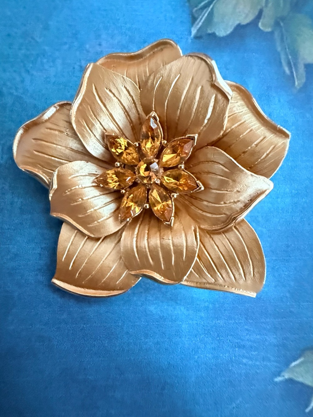 Gold Floral Brooch with Amber Crystal Center
